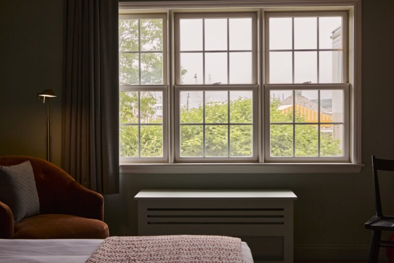 A king guest bedroom at The Harbor Front Inn.