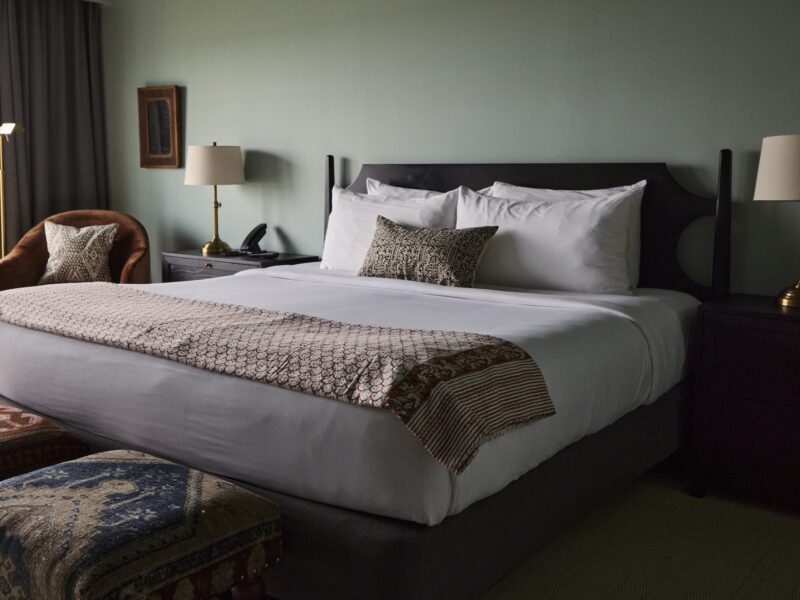 A king bed at The Harbor Front Inn.