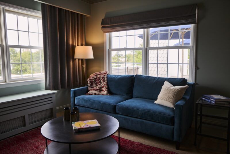 A seating area with a sofa in the Terrace Suite at The Harbor Front Inn.