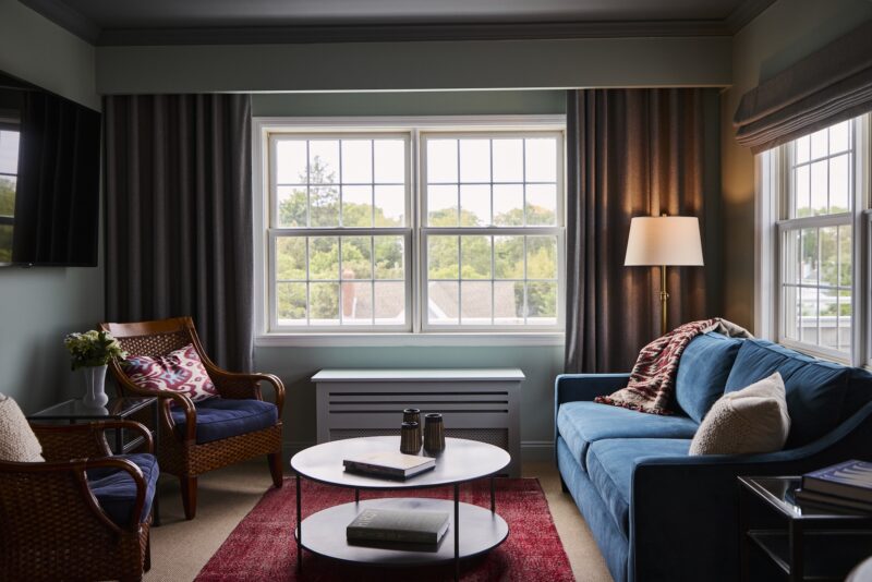 A seating area with a sofa and two chairs in the Terrace Suite at The Harbor Front Inn.