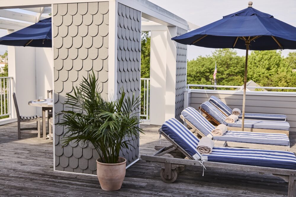 Loungers and umbrellas on the terrace at The Harbor Front Inn.