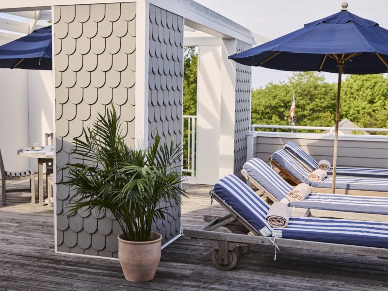 Loungers and umbrellas on the terrace at The Harbor Front Inn.