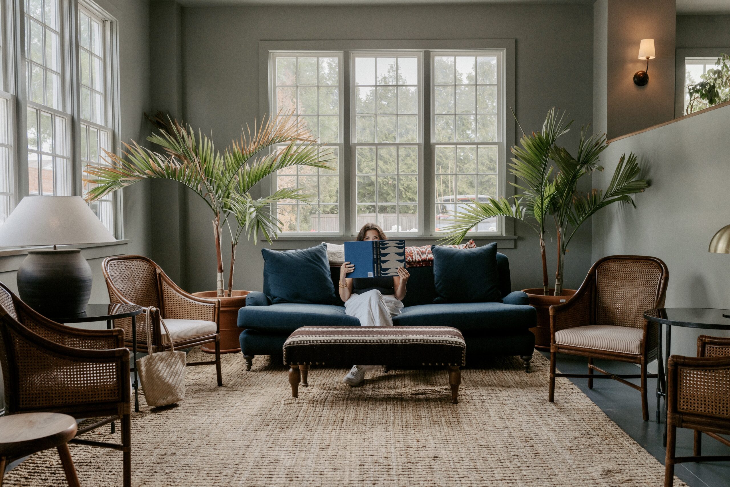 Girl with book in hotel lobby