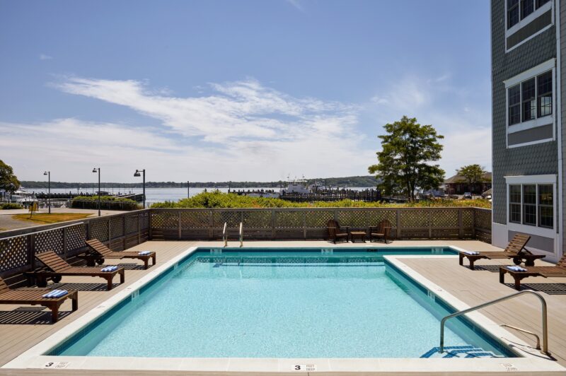 An outdoor pool with lounge chairs.