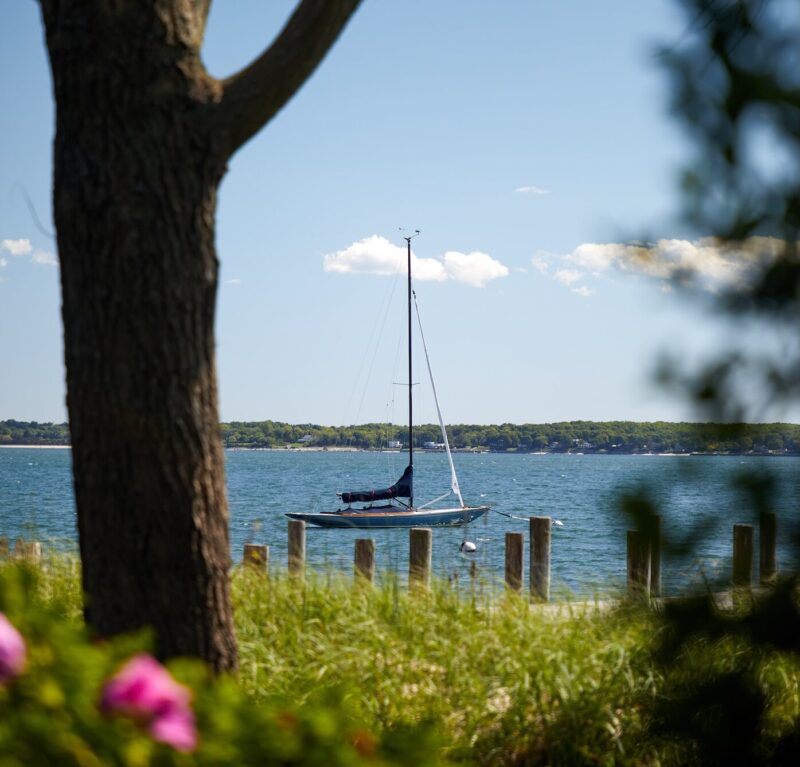 A boat sailing on the water in Greenport, NY.