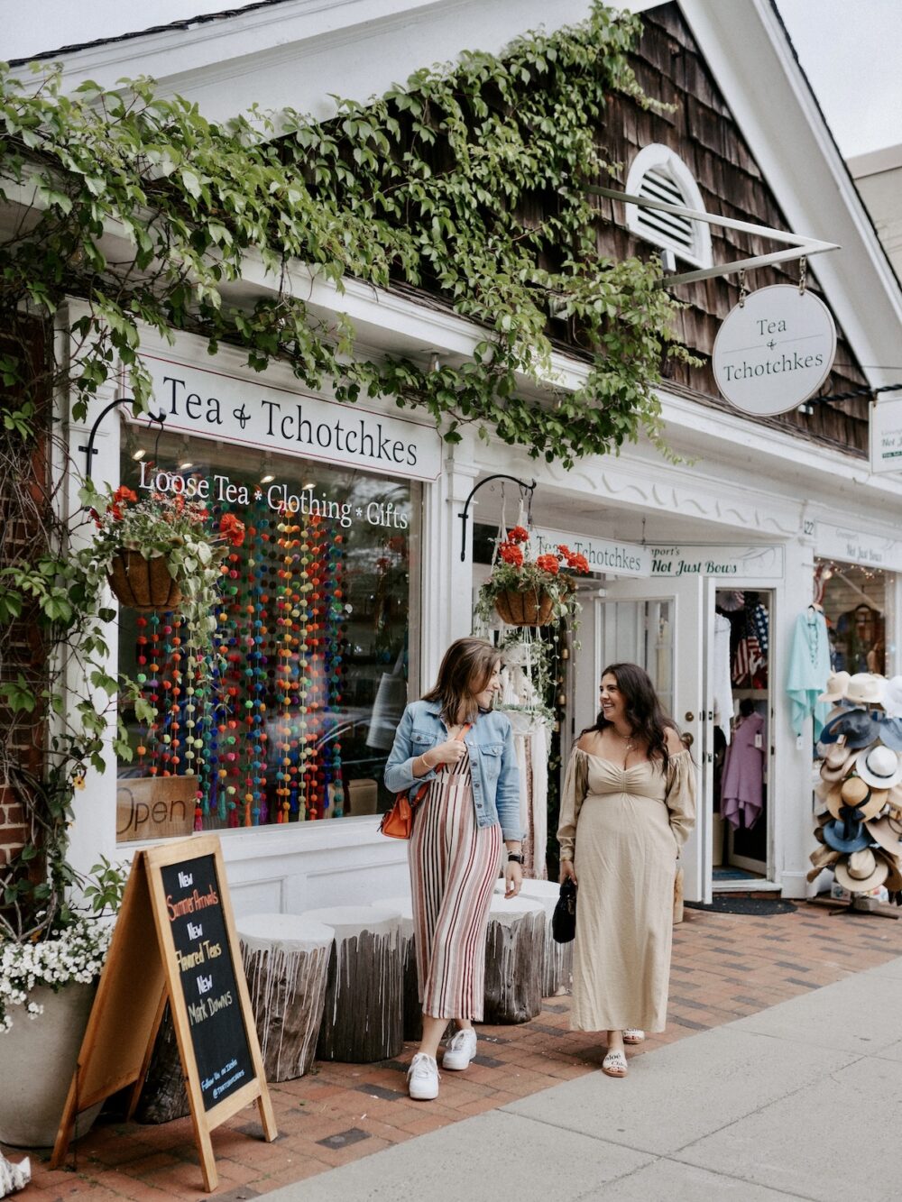 Two women walking in Greenport Village, New York.