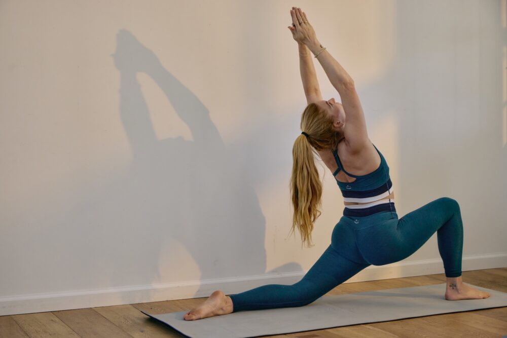A woman practicing yoga.
