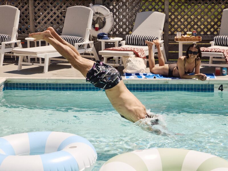 A man diving into the pool.