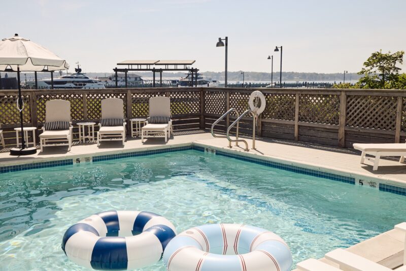 Blue and white pool floats in a pool.