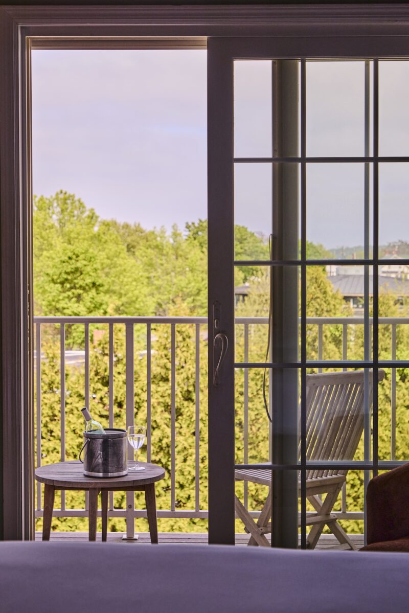 A patio overlooking the harbor off a guest room at The Harbor Front Inn.